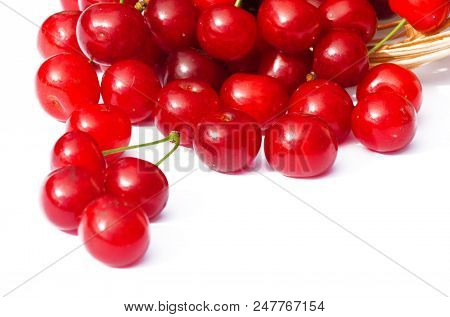 Red Ripe Cherry On A Background