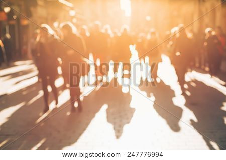 Blurred Background Made Of People Walking Through The City