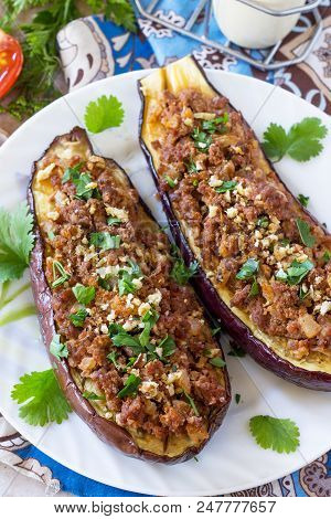 Classic Baked Eggplant Close-up With Meat, Walnut And Vegetables. Traditional Middle Eastern Or Arab