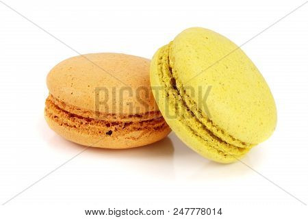Orange And Yellow Macaroon Isolated On White Background Closeup.