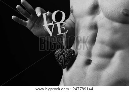 Male With Naked Torso Isolated On Black Background. Athletes Body In Close Up, Hand Holding Love Sig