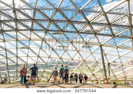 Moscow - June 17, 2018: People Visit A Modern Amphitheater With Glass Dome In Zaryadye Park Near Mos