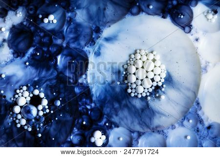 Abstract Nbackground Or Texture Beads In A Blue Oil Solution