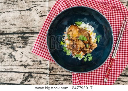 Vietnamese style caramel pork with rice and vegetable