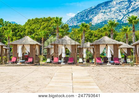 Wooden Beach Pavilions On The Shore Of A Sandy Beach - The Mediterranean Coast, Beldibi, Antalya, Tu