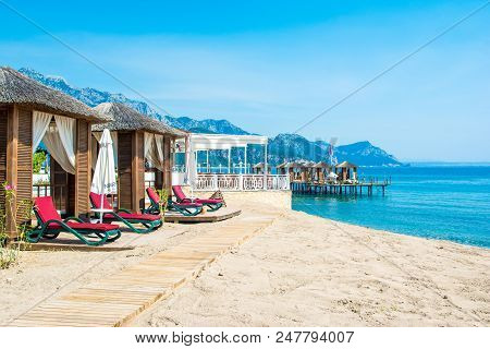 Antalya, Turkey - 8 May 2018: Wooden Beach Pavilions On The Shore Of A Sandy Beach - The Mediterrane