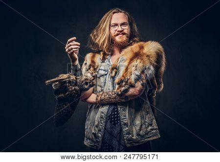 Portrait Of A Smiling Tattoed Redhead Hipster Male With Long Luxuriant Hair And Full Beard Dressed I