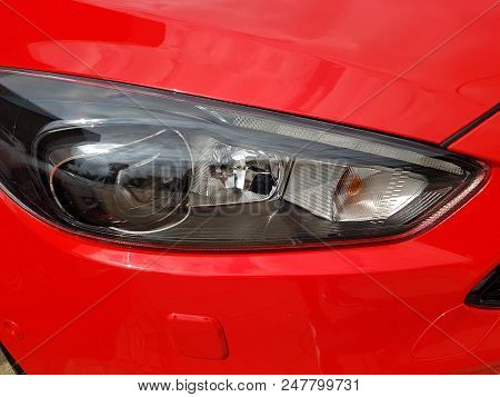 Headlamp On Modern Nice New Red Car