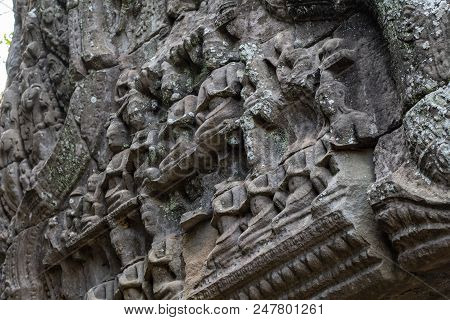 Ancient Temple Stone Carved Bas-relief In Angkor Wat. Praying People Bas-relief Closeup. Angkor Wat 