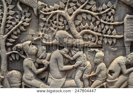 Ancient Temple Stone Carved Bas-relief In Angkor Wat. Mother And Child Bas-relief Closeup. Angkor Wa