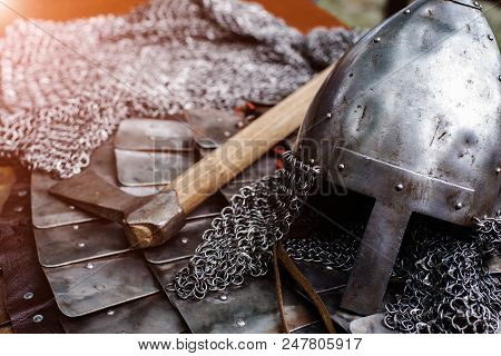 Iron Helmet In Armor And Battle Ax With Shallow Depth Of Field