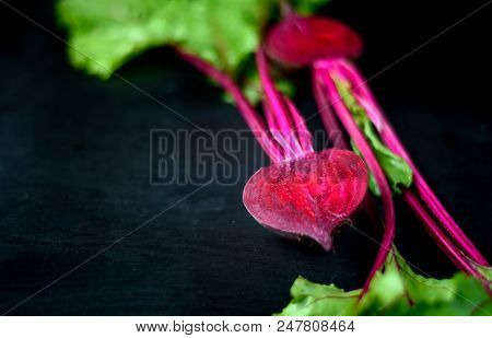 Beetroot Cut In Half On A Dark Background, Place For Text