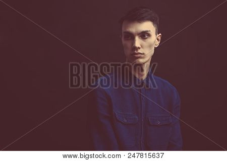 Close Up Portrait Of Good-looking Serious Man With Healthy Clean Skin Posing Isolated Against Black 