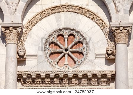 Romanesque facade detail of Roman Catholic basilica San Michele in Foro in Lucca, Tuscany, Italy