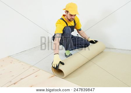 flooring work. underlayer installation at preparation for wood parquet floor