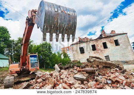 excavator crasher machine at demolition on construction site