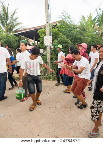 Group Dancing. Local People Participate On The Way To The Temple. Thai Buddhist Culture. Annual Dona