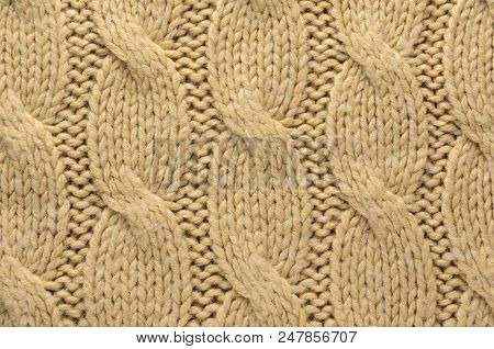 Knit Texture Of Beige Wool Knitted Fabric With Cable Knits Pattern As Background
