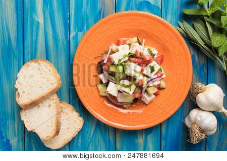 Greek salad with feta cheese cubes and fresk vegetables