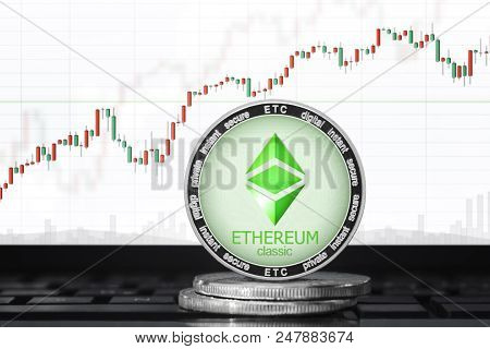 Ethereum Classic Coin; Ethereum Classic (etc) Cryptocurrency On The Background Of The Trading Chart