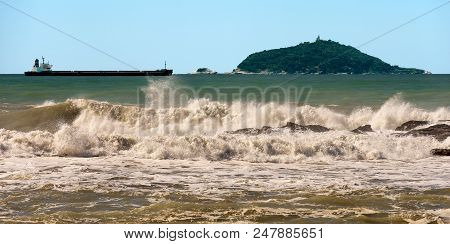 The Tino And Tinetto Island In The Gulf Of La Spezia With An Empty Container Ship And Waves. Liguria