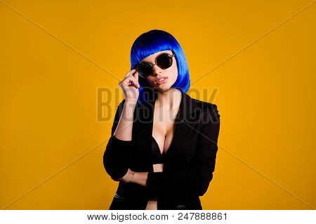 Portrait Of Rich Luxury Girl In Bright Blue Wig Glasses Big Tits Holding Eyelet Looking At Camera Is