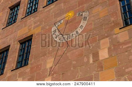 Medieval Sundial On The House Wall In Old Town Of Nuremberg, Germany. Sights Of Bavaria.