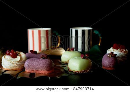 Moscovie Cakes Purple And Lemon Yellow. Pistachio And Fruit. Meringue Anna Pavlova . Culinary Art. G