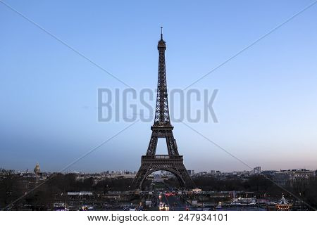 Eiffel Tower On Champs De Mars In Paris, France At The Evening