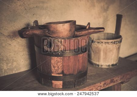 Old Wooden Barrel And Scoop. Wooden Barrel, Trough, Scoop In Old Country House.