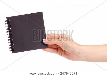 Notepad With Black Paper In Hand On White Background Isolation