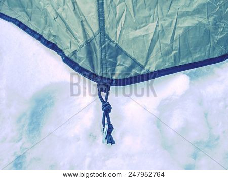 Rope On A Camp Tent, Detail Of Anchored Tent In Snowy Ground Within Extreme Mountain Trail.
