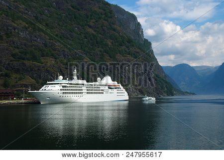 Cruise Liner In Sea Port On Mountain Landscape In Flam, Norway. Holiday Ship In Sea Harbor With Gree