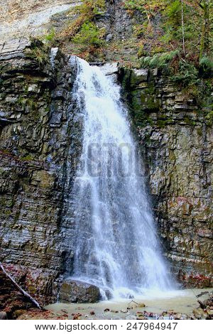 Waterfall With Water Falling From Cliff. Manyavskii Waterfall In Carpathian Mountains. Water Falling