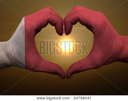 Heart And Love Gesture By Hands Colored In Bahrain Flag During Beautiful Sunrise