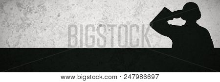 Portrait of confident soldier giving salute against grey background