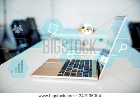 Laptop On The Table In The Meeting Room. Fintech And Technology
