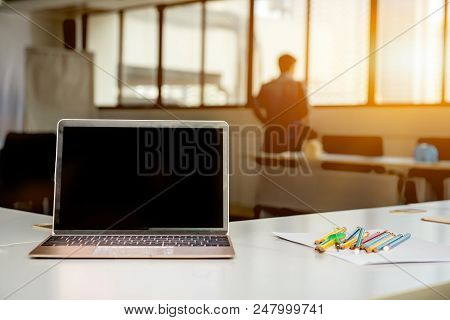 Laptop On The Table In The Meeting Room. Fintech And Technology