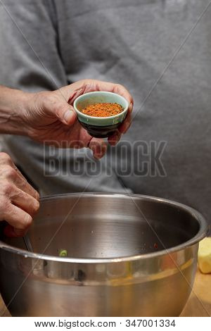 Chef Preparing Ingredients And Teaching How To Make Sushi Mixing Tuna And Seasonings In A Bowl