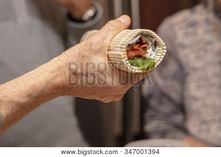 Sushi Roll Being Made In A Demonstaration Class