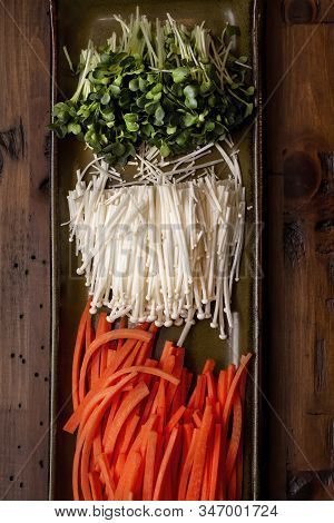 Radish Sprouts, Enokitake Mushrooms And Carrots Prepared To Add As Ingredients For A Sushi Roll Clas