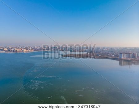 Aerial Landscape Photo Of Morii Lake , Bucharest, Romania With Many Buildings In The Distance.