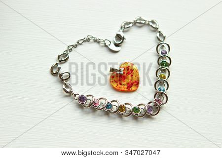 Gifts For Your Beloved Woman Or Girl. Amber Pendant In The Shape Of A Heart And A Bracelet With Ston