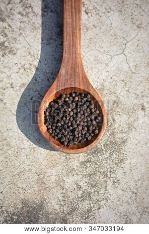 Black Peppercorns (kali Mirch) In Wooden Spoon