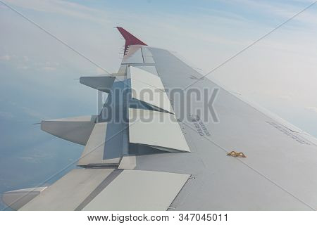 Airplane Wing View From The Passenger Seat.