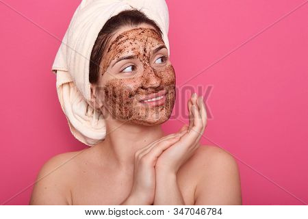 Close Up Portrait Of Girl Wrapped Hair With Towel, Posing With Skin Covered By Mask. Model With Brow