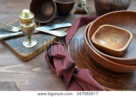 Rustic Pottery And Kitchen Silver On Wooden Dark Table