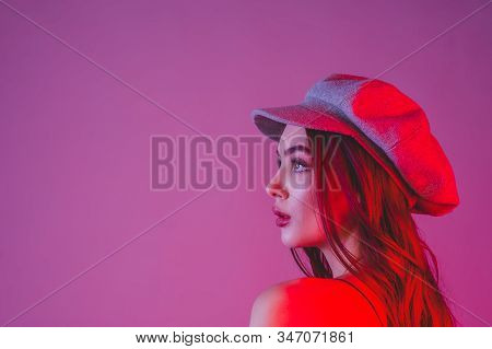 Photo With Tinted. Profile. Girl In Profile Biret Looks Into The Distance Color Filter Pink Backgrou