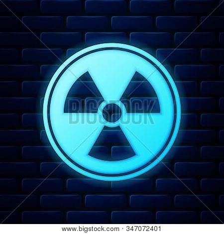 Glowing Neon Radioactive Icon Isolated On Brick Wall Background. Radioactive Toxic Symbol. Radiation
