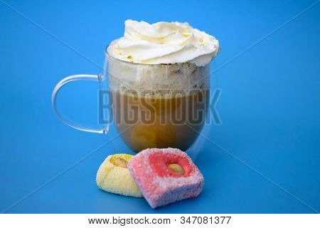 Cappuccino With Whipped Cream On A Blue Background. Double Bottom Cup With Coffee And Pink Rahat Lak